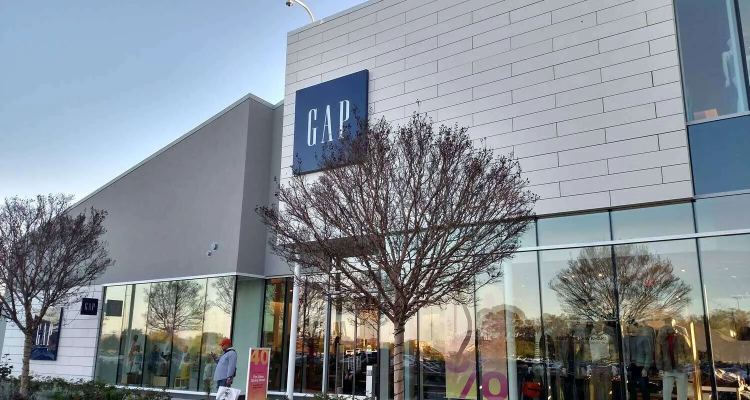 Exterior view of Gap store in Corte Madera with glass windows and modern design.